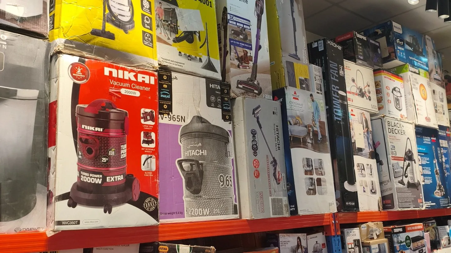 Household appliances displayed together inside Prime Open Box