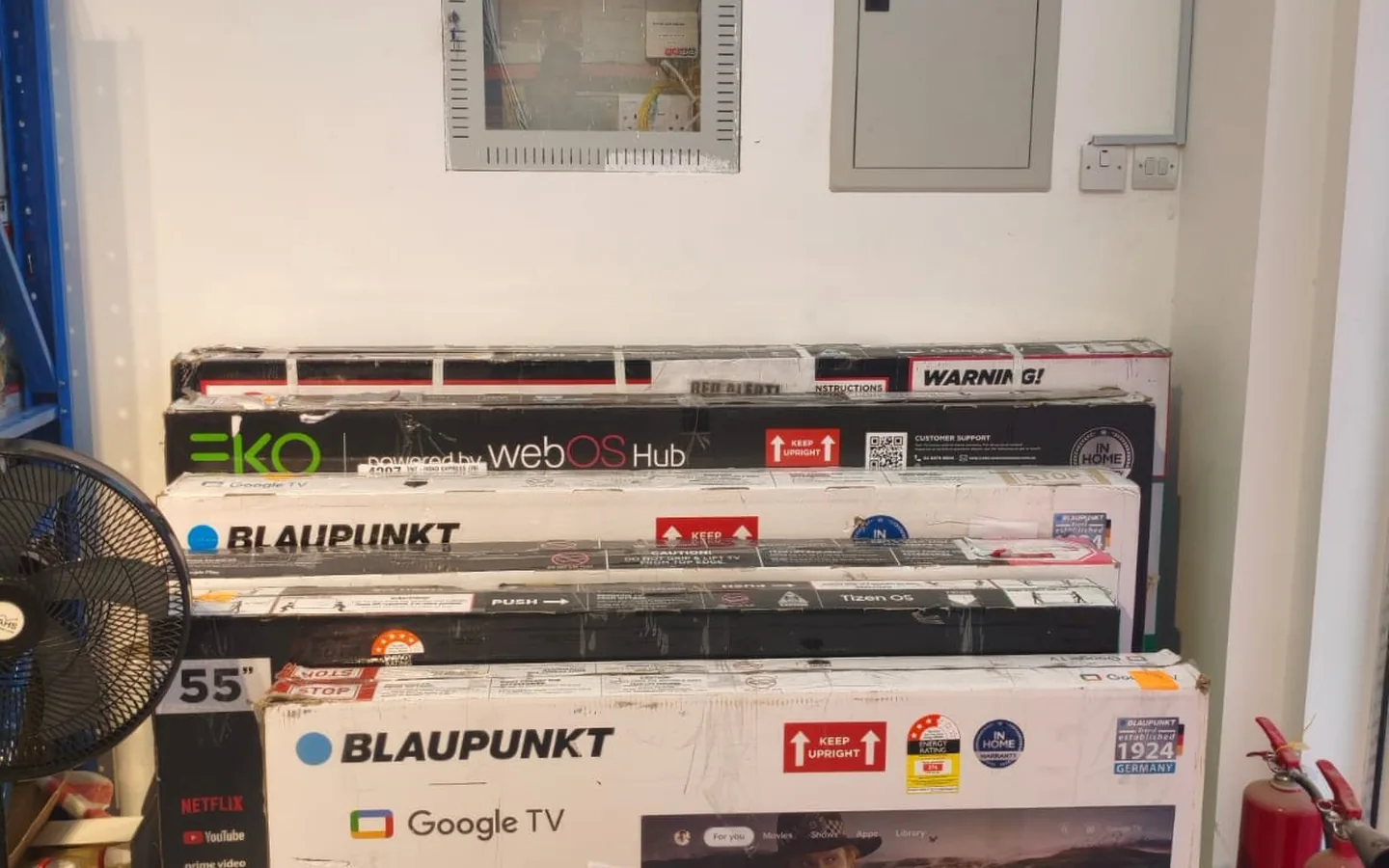 Rows of home appliances displayed on shelves in Al Ain
